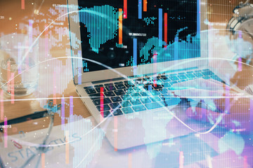 Multi exposure of businessman working on laptop on background. International business hologram in front. Concept of success.