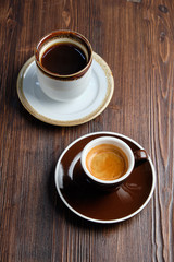 Cappuccino on a brown wooden background. Menu