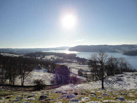 Sun Across Snow Covered Landscape