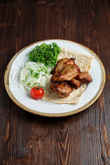 Skewers of chicken with thin pita bread . catering menu