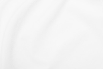 White fabric texture background with soft waves.