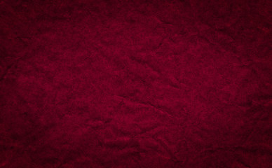 Closeup crumpled dark red color paper  texture backdrop. Burgundy ,Red paper sheet board with space...