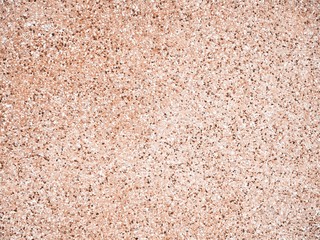 Closeup of cement wall in warm brown tone with texture of stone and gravel and rough surface for background and decoration. Cool banner on page, ad, presentation
