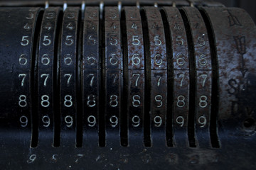 An old vintage cash register with lots of numbers