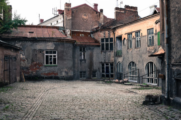 Fototapeta na wymiar old abandoned courtyard in the city of Vyborg, Russia