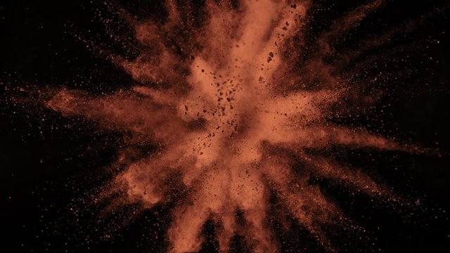 Super Slow Motion Shot of Cocoa Powder Explosion Isolated on Black Background at 1000fps. Shooted with High Speed Cinema Camera at 4K.
