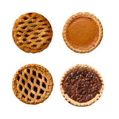 Fototapety  Fresh baked holiday pies Pumpkion, Apple, Pecan and Berry on white.