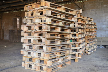 Empty wooden pallets are folded for later use. Not big business.