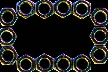 close up view of shiny metal nuts rows isolated on black with copy space