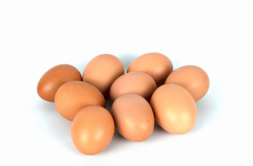 Fresh organic brown eggs isolated in white background