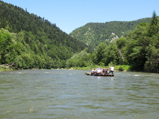 Tourists raft on the Dunajec river. Pieniny National Park. State border Slovakia and Poland