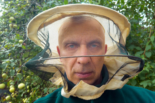 Beekeeper With A Serious Look On His  Face