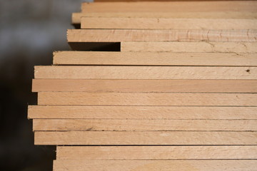 Wooden boards harvested for the furniture industry. With a shallow depth of field. Tree structure.