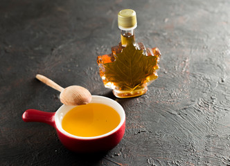 Maple Canadian syrup in a glass bottle. © Oleksandr