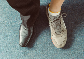 Businessman change shoes on sneakers. Healthy lifestyle balance concept.  