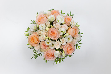 Wonderful flower arrangement in a hat box on a light background (Flowers: Rose, Eustoma. Colors: white, pink, beige)