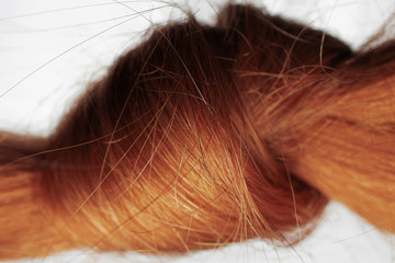 Macro shot of hair knot, henna color