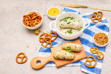 Oktoberfest set. White sausage weisswurst, pretzels, mustard, spikelets of grain, hop