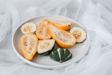 side view of sliced squash on white plate