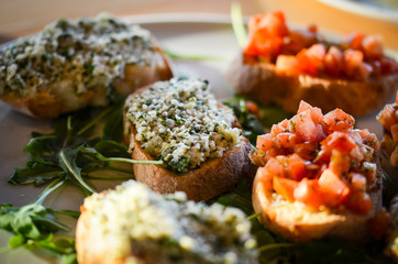 mix bruschetta with fresh vegetables, goat cheese & grapes