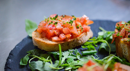 mix bruschetta with fresh vegetables, goat cheese & grapes