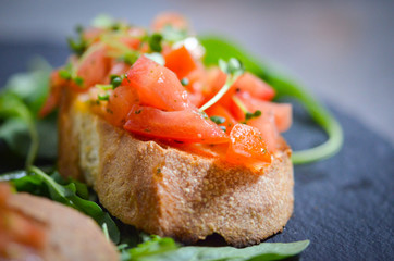 mix bruschetta with fresh vegetables, goat cheese & grapes