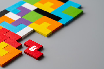Contact us icon on colorful puzzle