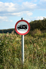 Round 7.5 tonne sign in the village road. Selective focus in sign