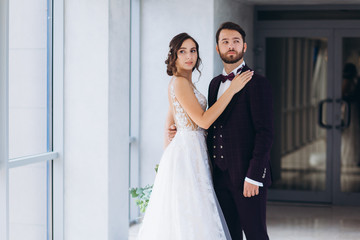 Fototapeta premium The bride and groom in the hotel building.