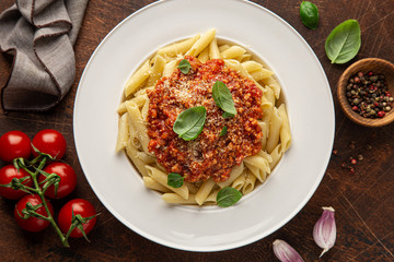 penne pasta with Bolognese sause in white plate