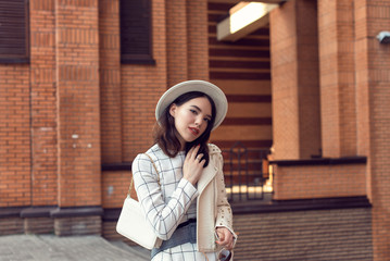 Stylish young girl in an autumn look