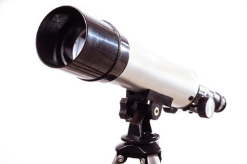telescope on a white background laid on wooden board