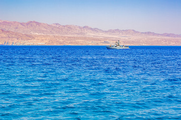 Gulf of Aden Middle East scenery landscape desert sea view with Saudi Arabia military patrol ship and mountain ridge background 