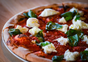 tasty italian pizza with fresh ingredients & vegetables