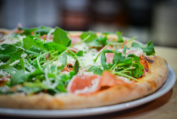 tasty italian pizza with fresh ingredients & vegetables
