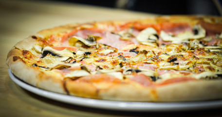 tasty italian pizza with fresh ingredients & vegetables