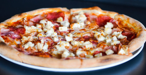 tasty italian pizza with fresh ingredients & vegetables