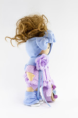 Handmade doll with natural hair. Isolated on a white background.