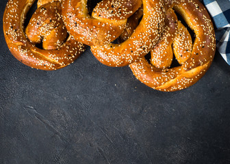 Oktoberfest food beer and bretzel on black.