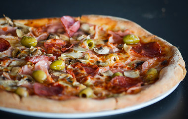 tasty italian pizza with fresh ingredients & vegetables