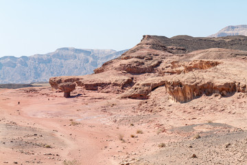 Desert mountains with an interesting geological formation on the front, Timna park, Israel