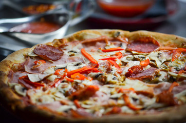 tasty italian pizza with fresh ingredients & vegetables