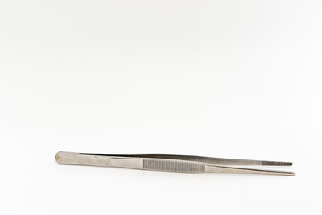Old stainless steel tweezers. Isolate on a white background.