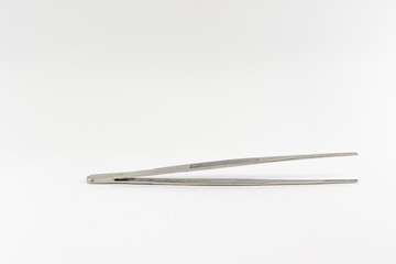 Old stainless steel tweezers. Isolate on a white background.