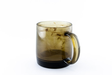 Dirty black glass coffee cup. Isolate on a white background.