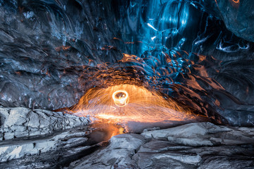 Fire show Inside an ice cave in Iceland