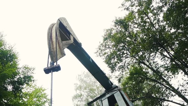 Oil pumping. Rocking machine. Energy