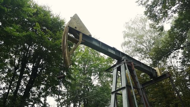 Oil pumping. Rocking machine. Energy