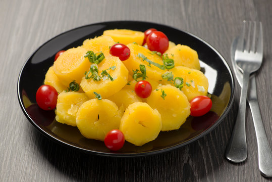 cooked cassava with cherry tomato