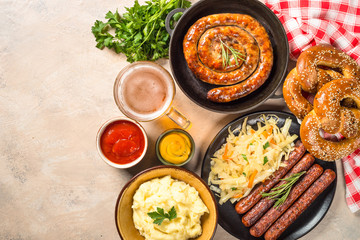 Oktoberfest food - sausage, beer and bretzel.